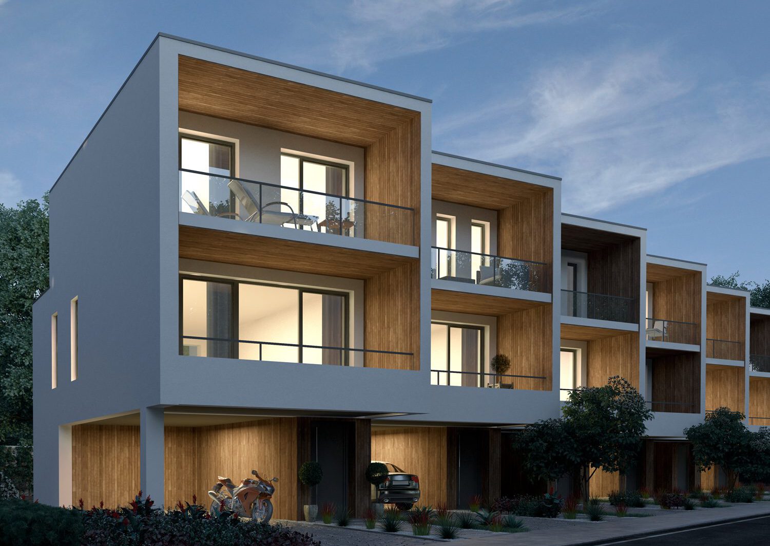 ein Wohnblock mit Balkonen und Garagen